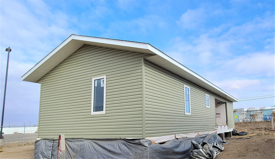 Exterior pic of green siding RTM